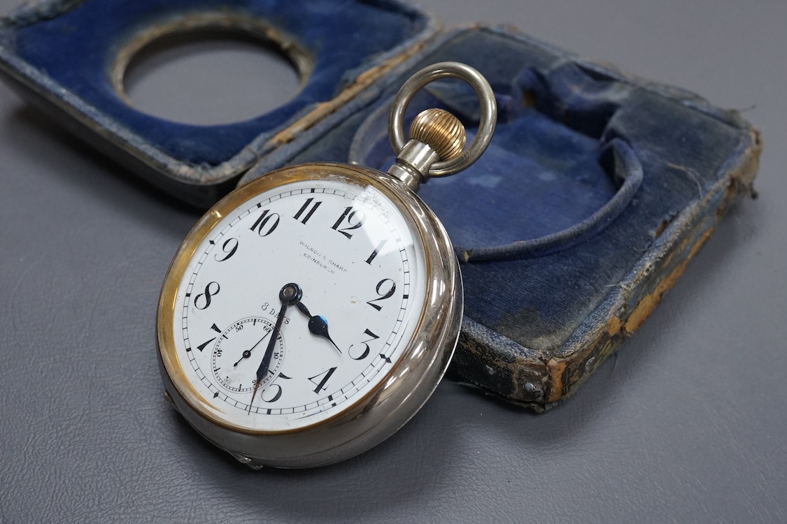 An Edwardian silver mounted travelling watch case, by William Comyns, London, 1903, width 10.2cm, containing a chrome cased pocket watch retailed by Wilson & Sharp.